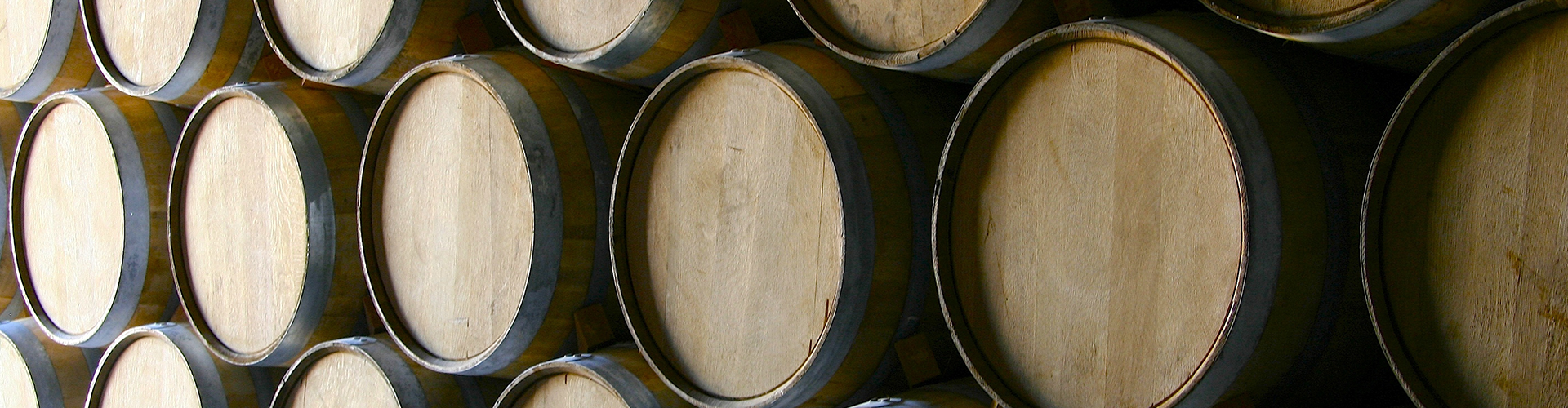 Wine barrels stacked in the cellar support the seasonal craft beer Sarasota offerings from Gulf Coast Brewing Company.