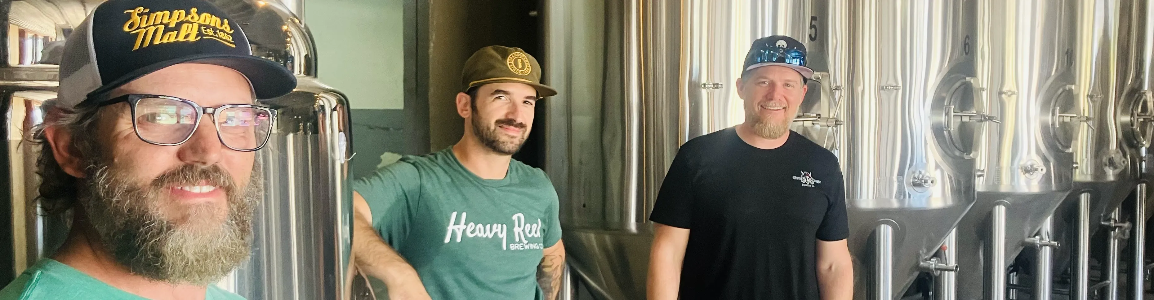 Founders of Gulf Coast Brewing Company pose proudly for a Sarasota craft brewery photo in Sarasota, FL.